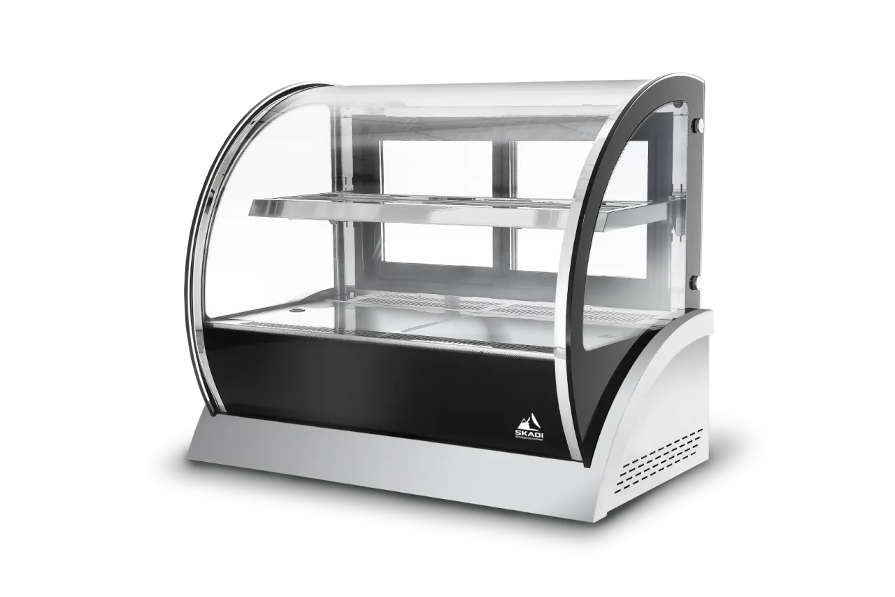 A sleek and modern [Curved Glass Countertop Cake Showcase | CTC] with a clear curved glass front, stainless steel shelves, and a compact design ideal for displaying cakes and pastries in small spaces.