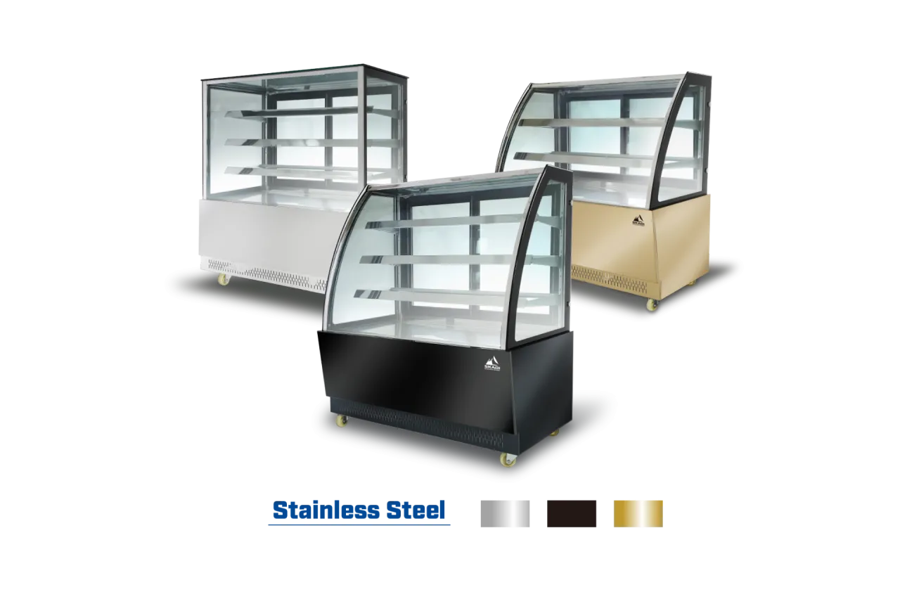 The High-End Panoramic Cake Display Showcase | PNC-T is displayed in three different finishes: stainless steel, black, and gold. Each unit has the same curved glass design and ample shelving to showcase products, with wheels at the bottom for mobility.