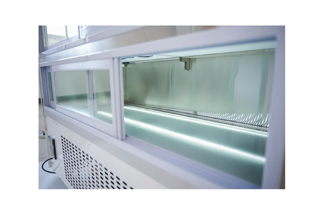 Side view of the Wide Commercial Cake Display Refrigerator | LJR, highlighting the interior lighting system and spacious refrigerated compartment.