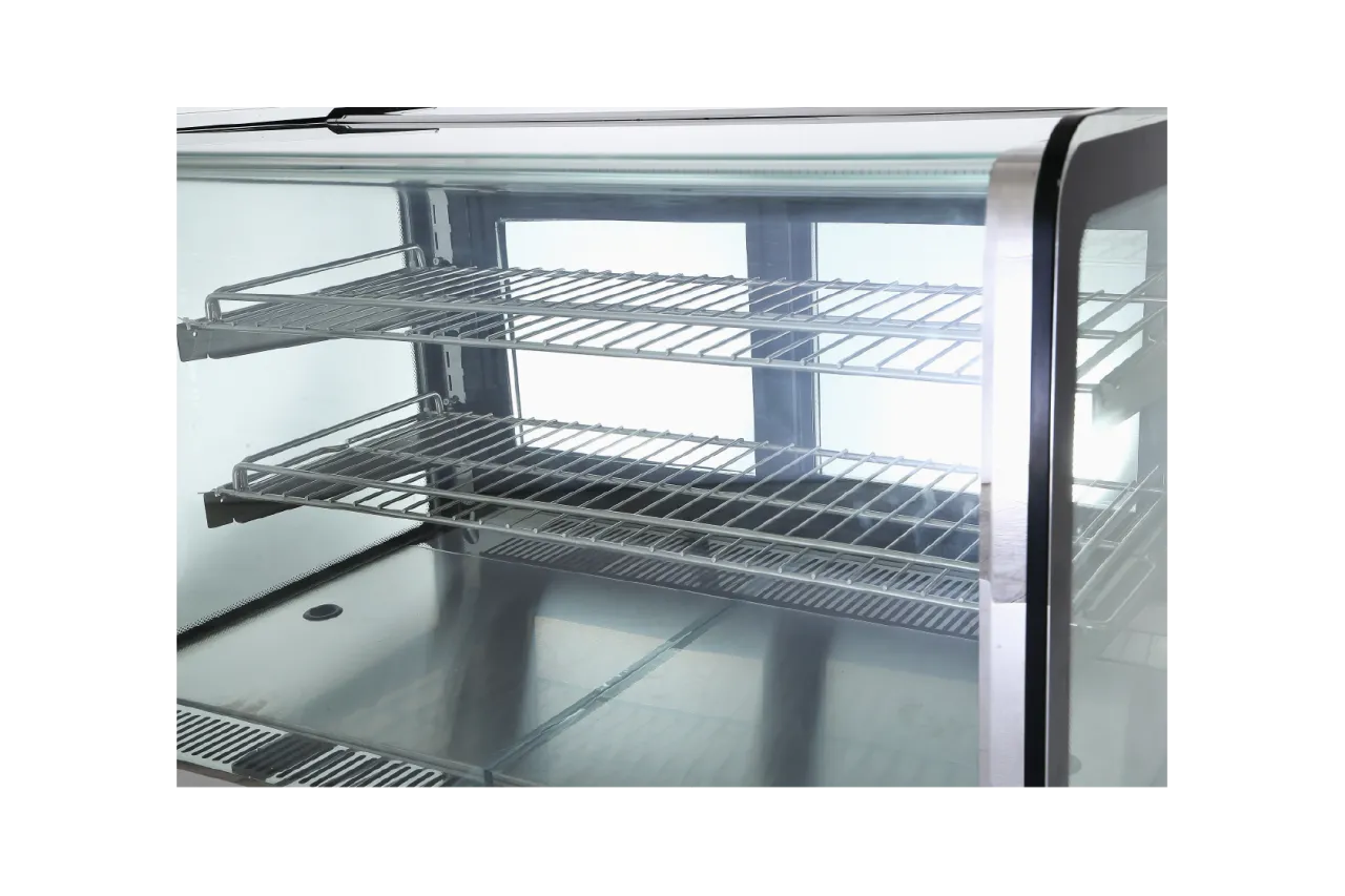 Close-up of the wire racks inside the Compact Countertop Commercial Cake Display Cabinet | CTSR, designed to display cakes or pastries.