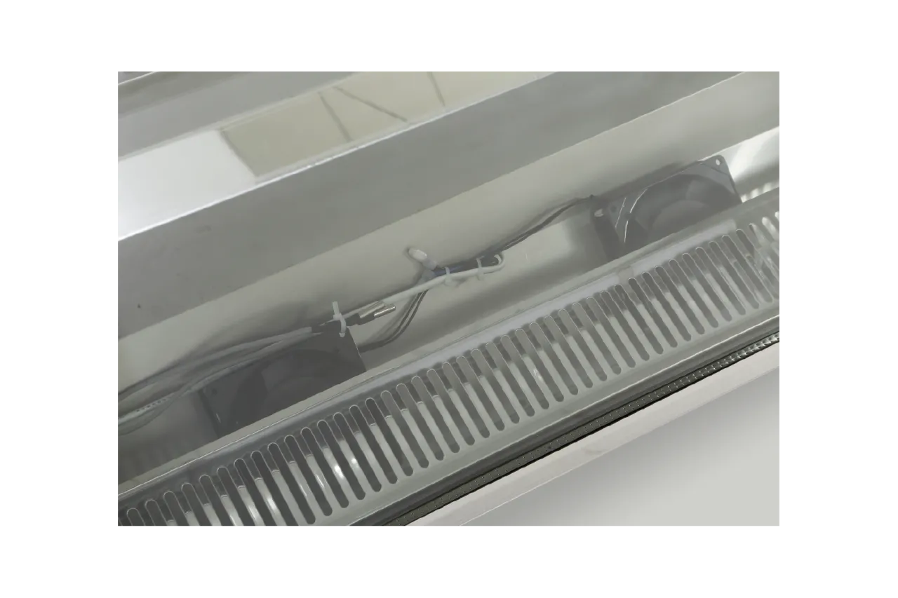 Detailed view of the ventilation and wiring system inside the [Panoramic Countertop Cake Display Showcase | CTSC085], highlighting internal components and air circulation mechanisms.