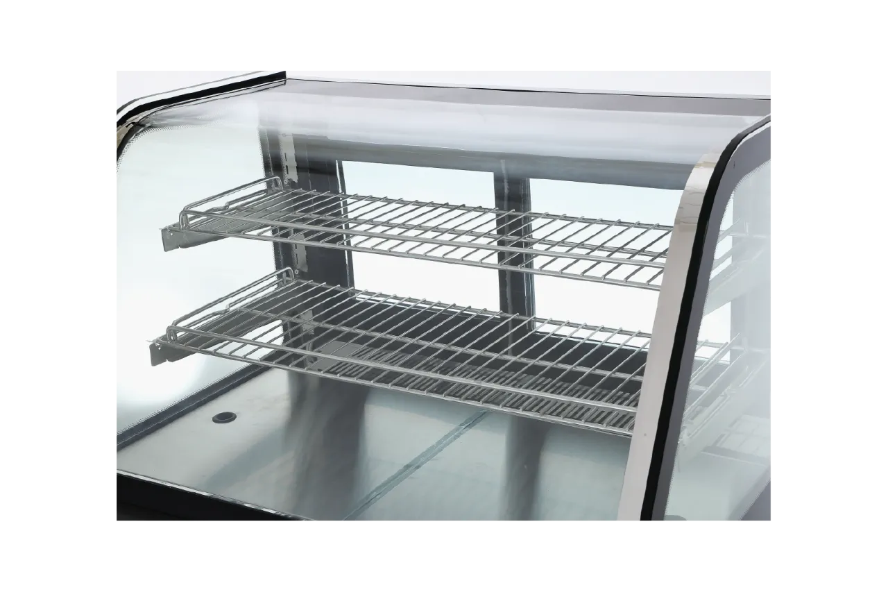 Close-up of the interior wire shelves of the Durable Countertop Commercial Cake Display Cabinet | CTSCO8, displaying spacious and sturdy racks designed for cake and pastry presentation.