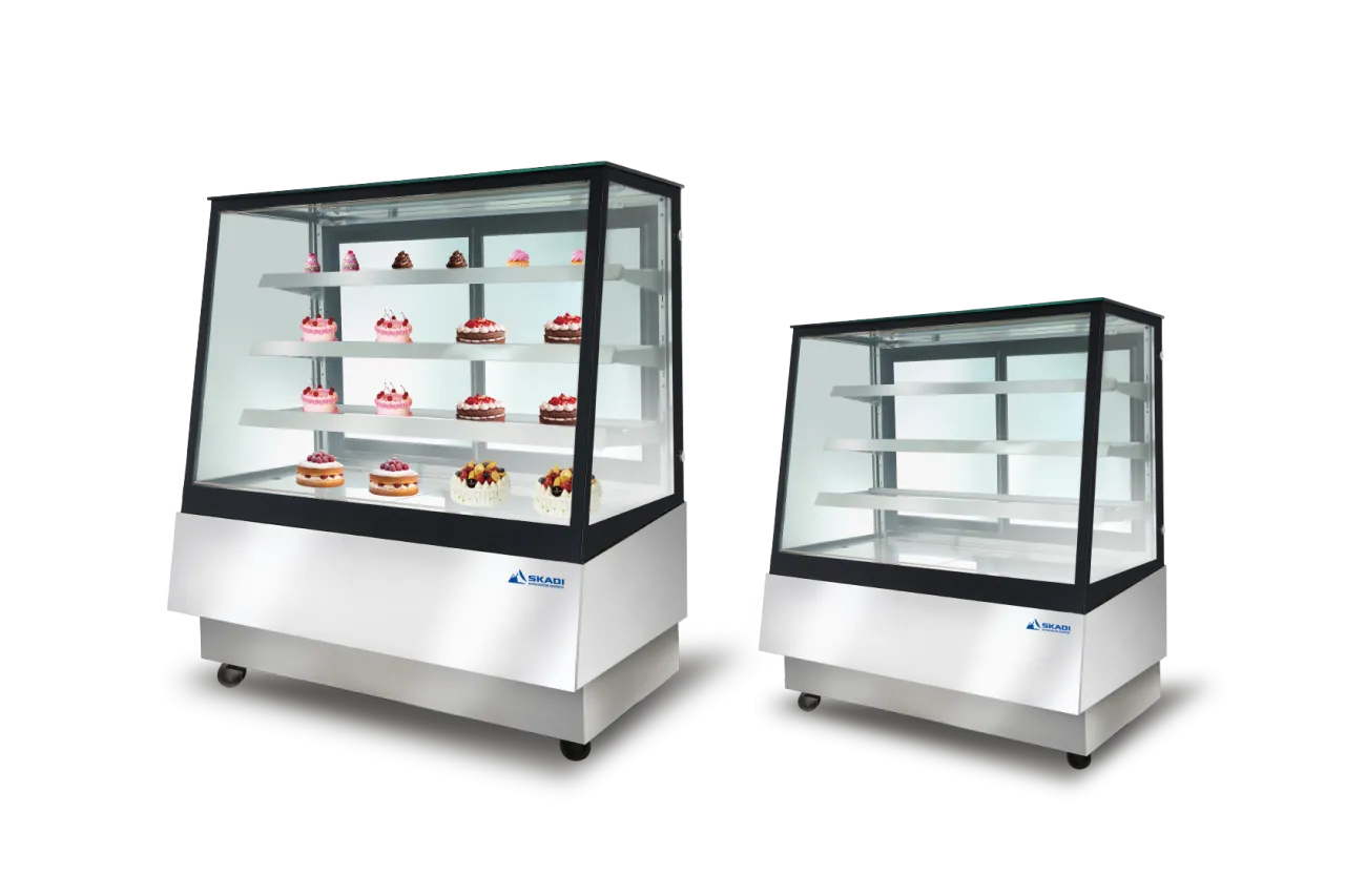 Two Full-View Pastry Display Cabinets with Right-Angle Design | ORX-T, one filled with pastries and cakes, the other empty, both highlighting multiple shelving for bakery products.