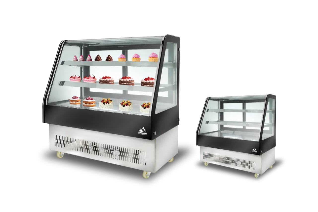 Two sizes of the Rectangular Commercial Cake Display Cabinet | ORD-D, both with glass fronts and internal shelves displaying various cakes, including cupcakes and pastries.