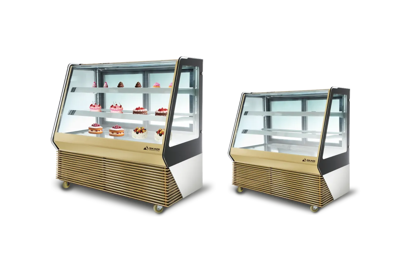 Two Elegant Cake Display Cabinets with Customizable Colors | TLC-D placed side by side, one filled with cakes and the other empty, highlighting their spacious and sleek design for optimal display.