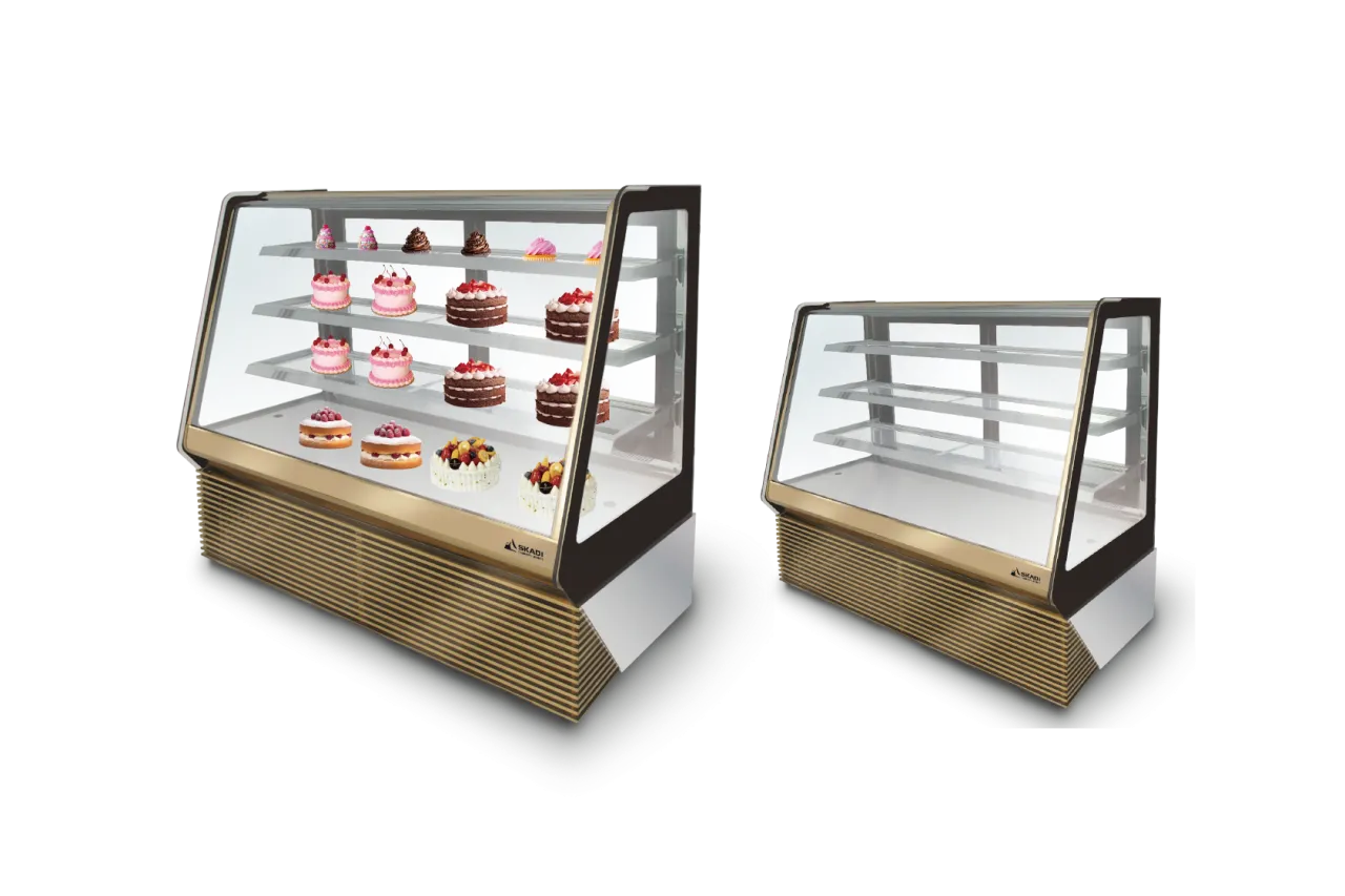 Two side-by-side models of the [Full-View Curved Glass Cake Display Showcase | TLR-T], one fully stocked with cakes and desserts and the other empty, highlighting its spacious interior and angled glass for maximum visibility.