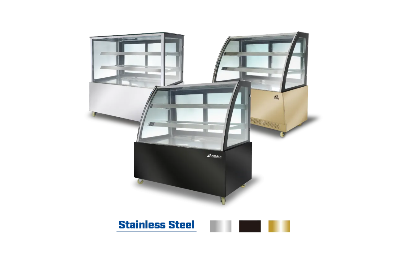 Image showcasing three Skadi refrigerated display cases in stainless steel, gold, and black finishes, with a text label "Stainless Steel" indicating available color options.