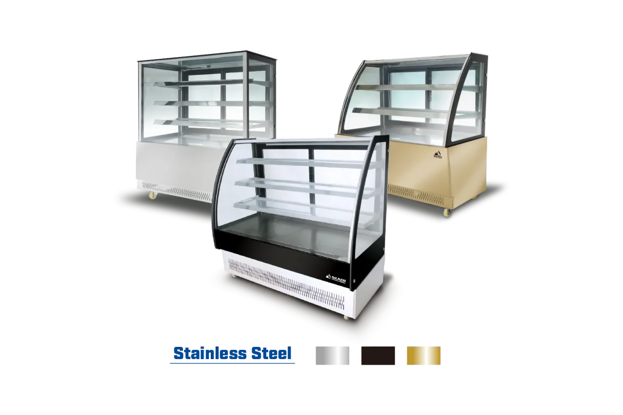 A group of three Full-View Curved Glass Pastry Display Showcase | ORC-T models, shown in different colors: stainless steel, black, and gold, with sleek, transparent fronts and glass shelves.