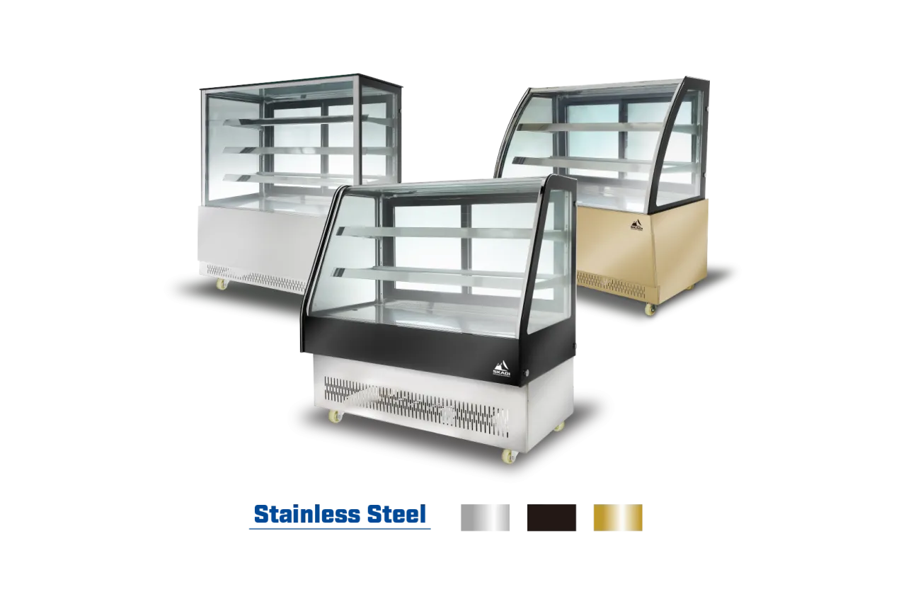 Three models of the Rectangular Commercial Cake Display Cabinet | ORD-D in different finishes: stainless steel, black, and gold. Each has a glass front and multiple shelves for cake display.