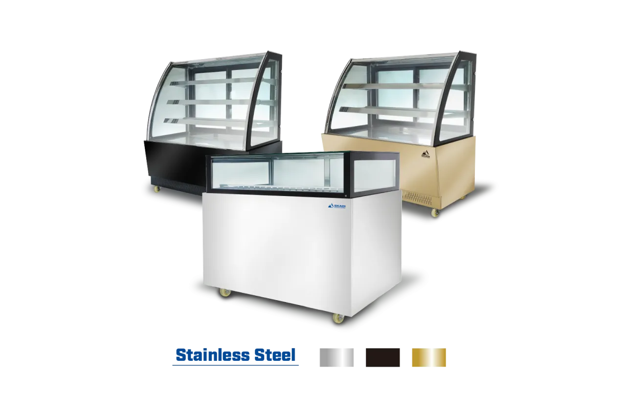 Three Low-Temperature Cake Display Showcase | JRS models in different colors—black, white, and gold—showcasing the display case variety, with glass front panels and interior shelving for showcasing cakes or pastries.