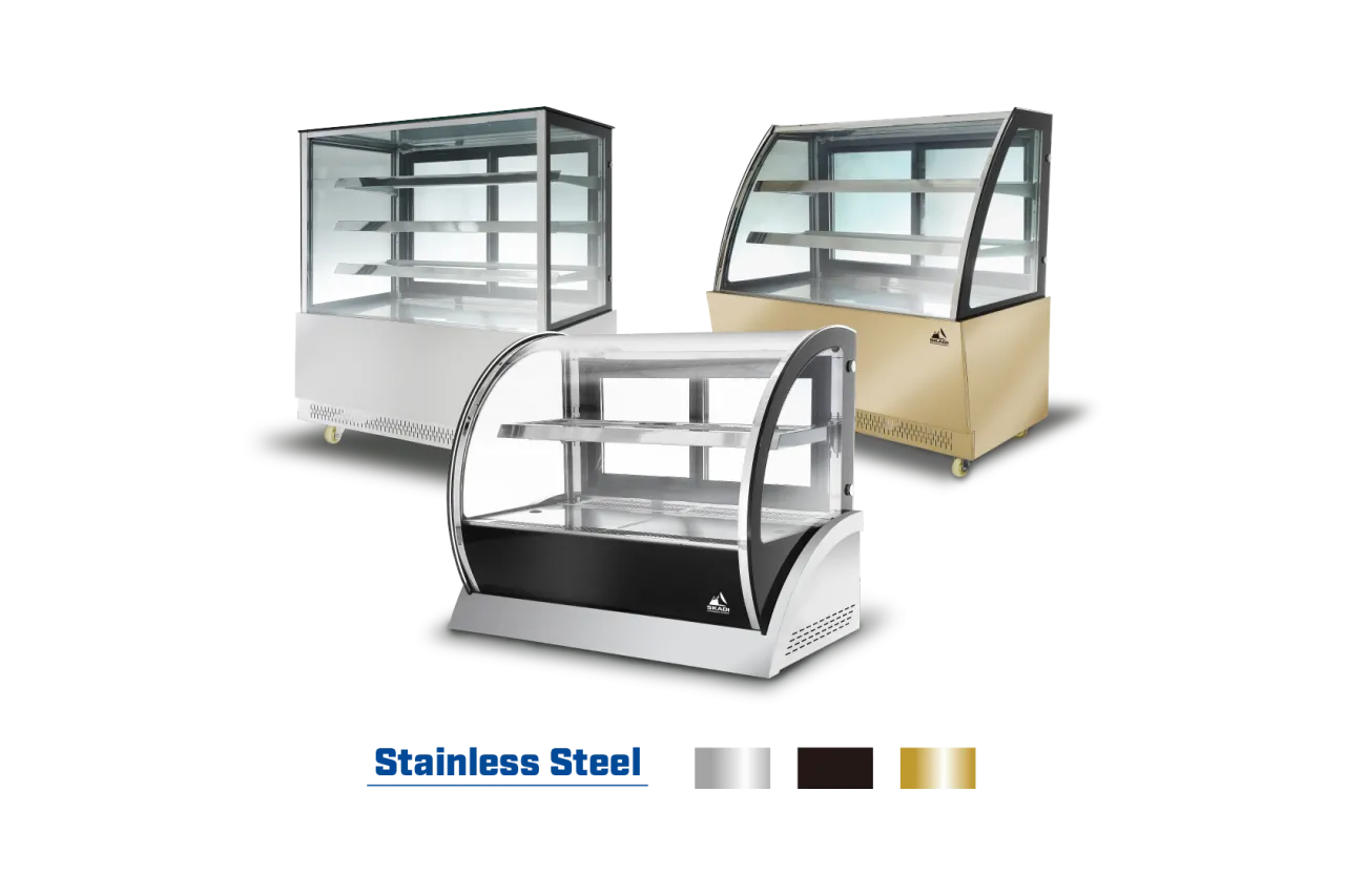 Three different models of the [Curved Glass Countertop Cake Showcase | CTC] in stainless steel, black, and gold finishes, showcasing versatility in design and color options for various display settings.